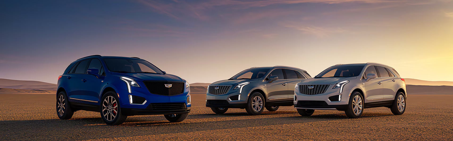 thre CADILLAC XT5 parked in deserted area