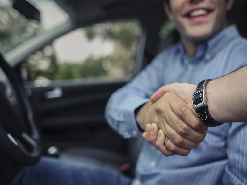 customer shakings hands with a sales rep from Fitzgerald Cadillac of Hagerstown in Hagerstown MD 