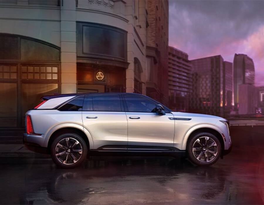 Escalade from Fitzgerald Cadillac of Hagerstown in Hagerstown MD driving in a city after a rain storm