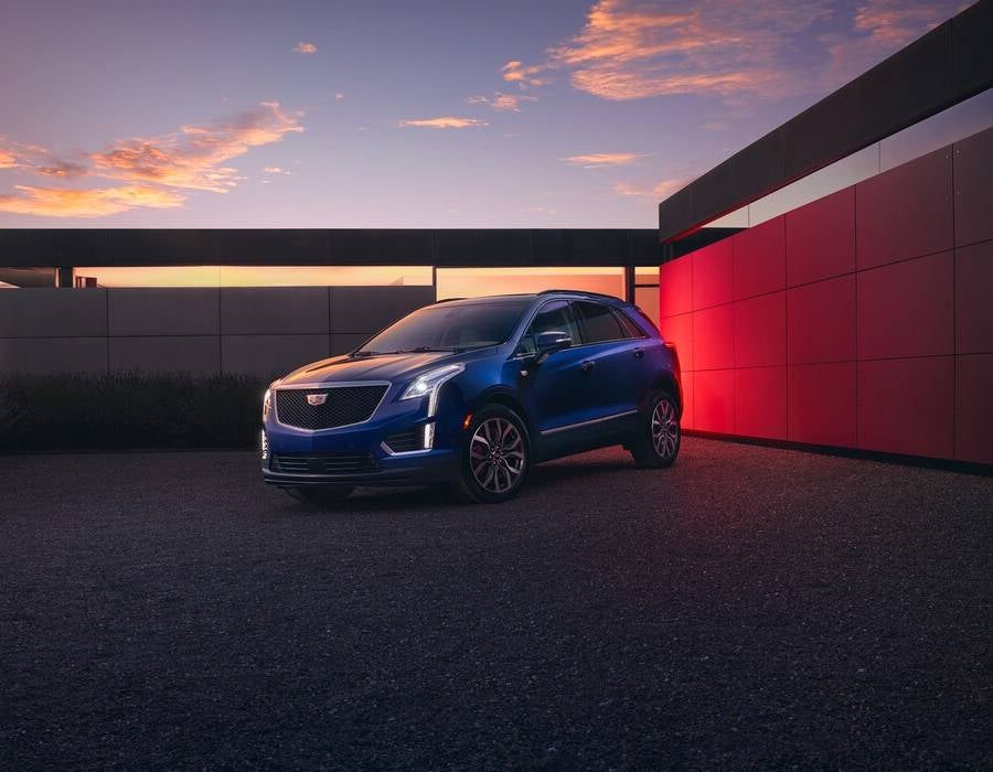 XT5 from Fitzgerald Cadillac of Hagerstown in Hagerstown MD parked in front of a modern building at night