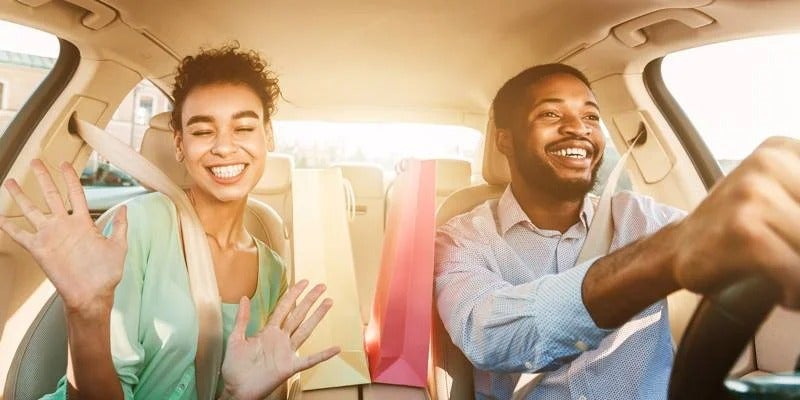 couple driving in their new car from Fitzgerald Cadillac of Hagerstown in Hagerstown MD 